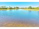 Scenic view of the waterway with a glimpse of the surrounding homes and community at 10064 Cozy Grove Dr, Venice, FL 34293