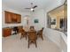 Bright breakfast nook featuring a workspace and outdoor views leading to the lanai at 101 Portofino Dr, North Venice, FL 34275