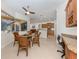 Cozy breakfast nook featuring a view of the outdoor pool area and connected to the kitchen at 101 Portofino Dr, North Venice, FL 34275