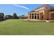 Beautiful lawn area behind the Tuscan-style clubhouse at 101 Portofino Dr, North Venice, FL 34275