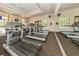 Gym with state-of-the-art treadmills and a view of the community pool at 101 Portofino Dr, North Venice, FL 34275