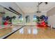 Gym with workout equipment and mirrors with view of the beautiful neighborhood at 101 Portofino Dr, North Venice, FL 34275