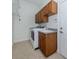 Laundry room with washer, dryer, sink, and tile flooring at 101 Portofino Dr, North Venice, FL 34275