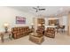 Open living area with adjacent kitchen, offering a seamless flow and comfortable seating at 101 Portofino Dr, North Venice, FL 34275