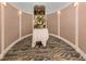 Elegant lobby with beautiful floral arrangement and decorative wall sconces at 101 Portofino Dr, North Venice, FL 34275