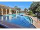 Sparkling community pool features lane lines, beautiful surroundings and lounge chairs at 101 Portofino Dr, North Venice, FL 34275