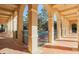 Covered walkway with arched columns reveals a refreshing community pool at 101 Portofino Dr, North Venice, FL 34275