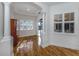 Sitting room with wood floors, plantation shutters, and views of the backyard pool at 101 Portofino Dr, North Venice, FL 34275