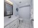 Bathroom featuring neutral walls, white cabinets and tile flooring at 1041 Capri Isles Blvd # 224, Venice, FL 34292