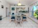 Bright dining area featuring kitchen passthrough, and abundant natural light at 1041 Capri Isles Blvd # 224, Venice, FL 34292
