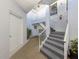 A welcoming entrance with staircase and white door provides access to the residence at 1041 Capri Isles Blvd # 224, Venice, FL 34292