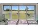 Bright lanai features large sliding windows with views of the community golf course at 1041 Capri Isles Blvd # 224, Venice, FL 34292