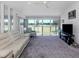 Bright living room with view of the backyard from expansive windows at 1041 Capri Isles Blvd # 224, Venice, FL 34292