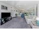 Bright living room with view of the backyard from expansive windows at 1041 Capri Isles Blvd # 224, Venice, FL 34292