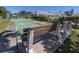 Community shuffleboard area with well-maintained courts, benches, and landscaping at 1041 Capri Isles Blvd # 224, Venice, FL 34292