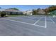 Community tennis court with new surface and landscaping at 1041 Capri Isles Blvd # 224, Venice, FL 34292