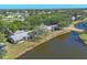 Spacious lakeside home with mature trees and lush landscaping, offering serene views and privacy at 109 Southampton N Pl # 245, Venice, FL 34293