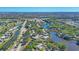 Beautiful aerial view of a community featuring lovely homes and winding waterways at 109 Southampton N Pl # 245, Venice, FL 34293