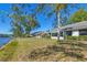 Spacious backyard extending to the waterfront, offering serene views and a tranquil setting at 109 Southampton N Pl # 245, Venice, FL 34293