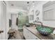 Bright bathroom featuring vessel sinks, a glass enclosed shower, and dual vanities at 109 Southampton N Pl # 245, Venice, FL 34293