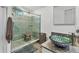 Stunning bathroom with walk-in shower, mosaic tile, and a unique vessel sink at 109 Southampton N Pl # 245, Venice, FL 34293
