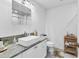 Modern bathroom showcasing a vessel sink, granite countertops, and a three-panel mirror at 109 Southampton N Pl # 245, Venice, FL 34293