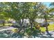 Well-maintained single-story home with a two-car garage and mature landscaping overlooking a pond at 109 Southampton N Pl # 245, Venice, FL 34293