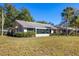 Charming single-story home with lush landscaping and well-maintained lawn at 109 Southampton N Pl # 245, Venice, FL 34293