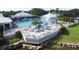 Inviting community pool area with a spacious deck, comfortable lounge chairs, and shaded umbrellas at 109 Southampton N Pl # 245, Venice, FL 34293