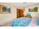Comfortable bedroom with a bed and dresser featuring a tv at 1110 Gladstone Blvd, Englewood, FL 34223
