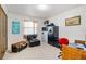 Functional bedroom featuring a desk and a large black safe at 1110 Gladstone Blvd, Englewood, FL 34223