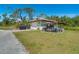 Detached garage featuring a separate workshop area at 1110 Gladstone Blvd, Englewood, FL 34223