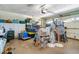 Spacious garage used for storage with rolling door and overhead lighting at 1110 Gladstone Blvd, Englewood, FL 34223