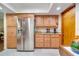 Bright kitchen features stainless steel refrigerator and ample cabinet space at 1110 Gladstone Blvd, Englewood, FL 34223