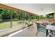 Enclosed lanai featuring multiple seating areas, and a jacuzzi at 1110 Gladstone Blvd, Englewood, FL 34223
