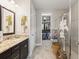 Bright bathroom with granite countertops, and a glass-enclosed shower at 11655 Renaissance Blvd, Venice, FL 34293