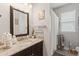 Bathroom features granite countertops, decorative mirrors, and modern fixtures at 11655 Renaissance Blvd, Venice, FL 34293