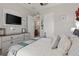 Comfortable bedroom showcases calming decor, and access to ensuite bathroom at 11655 Renaissance Blvd, Venice, FL 34293