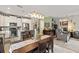Open-concept dining area connects seamlessly to the kitchen and living spaces with recessed lighting at 11655 Renaissance Blvd, Venice, FL 34293