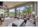 A spacious covered lanai with comfortable seating and serene views at 11655 Renaissance Blvd, Venice, FL 34293