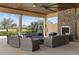 Enjoy the community outdoor fireplace lounge area overlooking a tranquil lake surrounded by lush landscaping at 11655 Renaissance Blvd, Venice, FL 34293