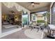 Inviting screened-in patio with brick flooring and comfortable seating, perfect for relaxation and entertaining at 11655 Renaissance Blvd, Venice, FL 34293