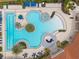 Aerial view displaying the luxurious community pool including an area for lounging, shallow and deep water at 11655 Renaissance Blvd, Venice, FL 34293