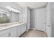 Bright bathroom with double vanity and large mirror, offering ample counter space and a clean, modern design at 13032 Oriago St, Venice, FL 34293