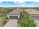 Charming single-story home with a well-manicured lawn and tile roof at 13032 Oriago St, Venice, FL 34293