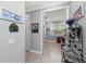 Hallway view leading into an office space with shutters on the window at 13032 Oriago St, Venice, FL 34293