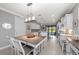 Spacious kitchen featuring an island with seating, pendant lighting, and backyard view at 13032 Oriago St, Venice, FL 34293