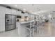 Bright open kitchen features a large island, stainless steel appliances, and modern lighting at 13032 Oriago St, Venice, FL 34293