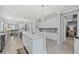Spacious white kitchen boasts granite countertops and seamless flow to dining and living areas at 13032 Oriago St, Venice, FL 34293
