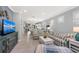 Bright living room featuring striped sofas, a white coffee table, and an open floor plan at 13032 Oriago St, Venice, FL 34293